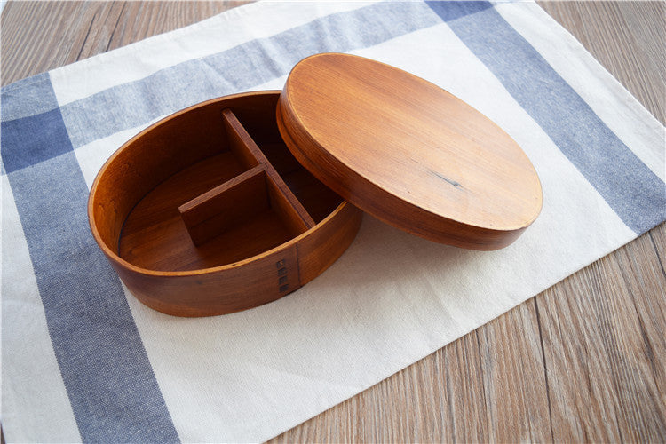 Round brown wooden bento box by WoodyKitchenware, traditional Japanese lunch box made of smooth polished wood.
