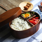 Round brown wooden bento box from WoodyKitchenware, traditional Japanese lunch box made of natural wood with a smooth finish.