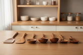 Acacia wooden spatula with long handle from WoodyKitchenware set, ideal for non-stick cookware, includes wooden spoon and soup spoon.