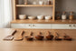 Acacia wooden spatula with long handle from WoodyKitchenware set, ideal for non-stick cookware, includes wooden spoon and soup spoon.