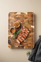 Dark brown Acacia Mangium thick cutting board by WoodyKitchenware, durable and stylish kitchen essential for food prep.