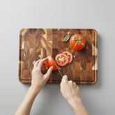 Dark brown Acacia Mangium thick cutting board by WoodyKitchenware, durable and stylish kitchen essential for food prep.
