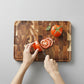 Dark brown Acacia Mangium thick cutting board by WoodyKitchenware, durable and stylish kitchen essential for food prep.