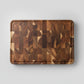 Dark brown Acacia Mangium thick cutting board by WoodyKitchenware, durable and stylish kitchen essential, 35x25x2.6cm size.