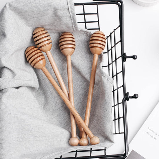 Wooden long handle honey coffee stirrer by WoodyKitchenware, elegant beechwood mixing spoon for stirring beverages.