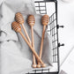 Wooden long handle honey coffee stirrer by WoodyKitchenware, elegant beechwood mixing spoon for stirring beverages.
