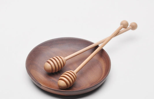 Wooden long handle honey coffee stirrer by WoodyKitchenware made of elegant beechwood for stirring beverages.