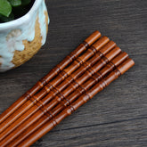 Pair of fired bamboo chopsticks by WoodyKitchenware, durable and eco-friendly dining utensils from WoodyKitchenware.
