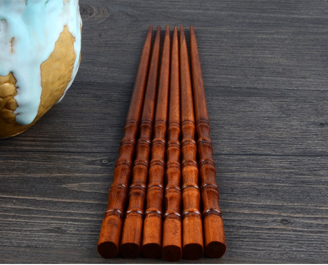 Pair of Fired Bamboo Chopsticks by WoodyKitchenware, durable and eco-friendly dining utensils with a smooth finish and natural bamboo look.
