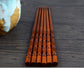 Pair of Fired Bamboo Chopsticks by WoodyKitchenware, durable and eco-friendly dining utensils with a smooth finish and natural bamboo look.