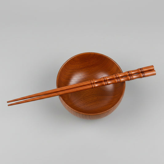 Pair of fired bamboo chopsticks by WoodyKitchenware, showcasing durable, eco-friendly dining utensils with a smooth finish.