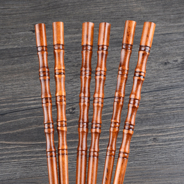 Pair of fired bamboo chopsticks by WoodyKitchenware, durable, eco-friendly dining utensils with a natural bamboo finish.