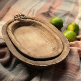 Charred Paulownia wood oval serving tray by WoodyKitchenware, featuring a smooth finish and natural wood grain details.