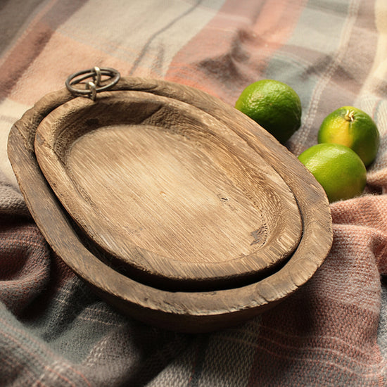 Charred Paulownia wood oval serving tray by WoodyKitchenware, featuring a smooth finish and natural wood grain details.