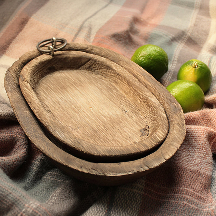 Charred Paulownia wood oval serving tray by WoodyKitchenware, featuring a smooth finish and natural wood grain details.