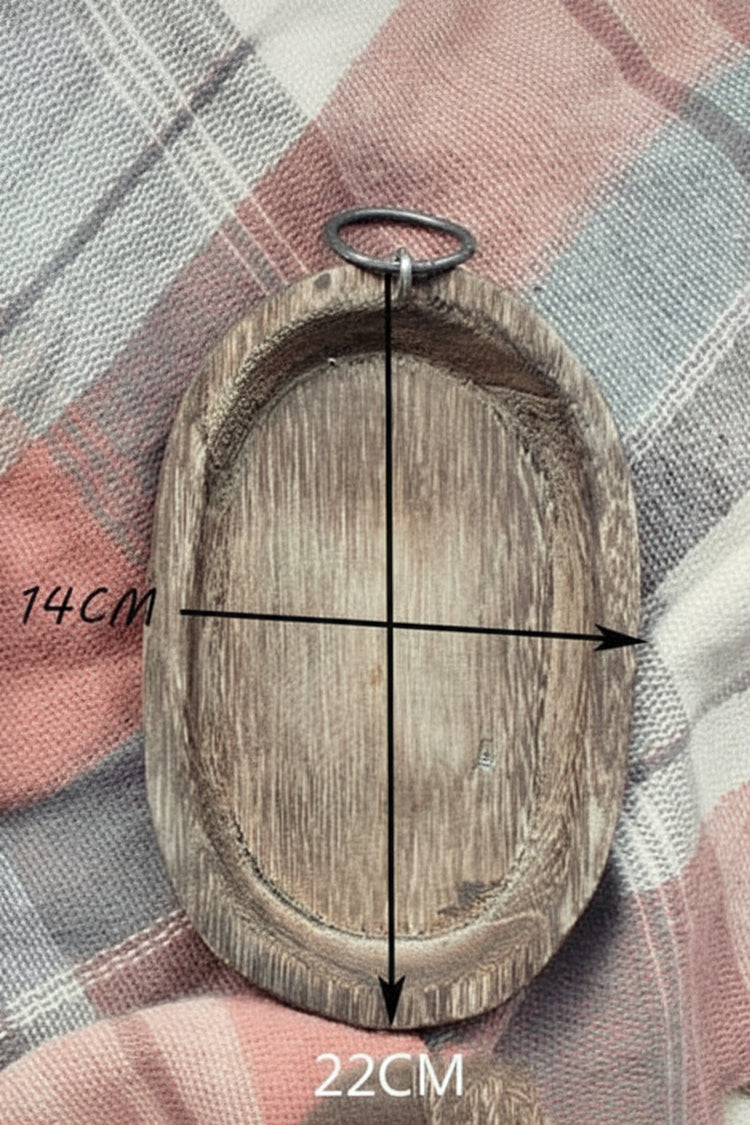 Charred Paulownia wood serving tray by WoodyKitchenware, oval-shaped with a rustic charred finish, perfect for serving or display.