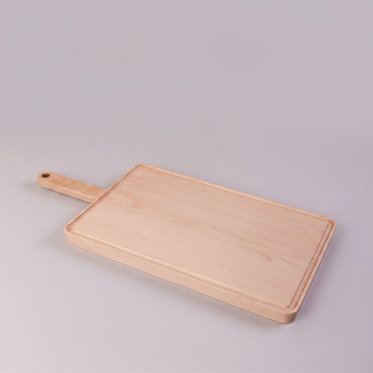 Square wooden chopping board with juice groove for bread, made by WoodyKitchenware, featuring a smooth maple surface and functional design.