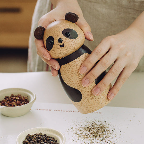 Cute wooden panda seasoning grinder by WoodyKitchenware with ceramic core and eco-friendly finish, featuring charming animal designs.