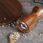 Manual pepper grinder by WoodyKitchenware with solid timber body, showcasing the fresh-flavor Pylon mill in natural wood finish.