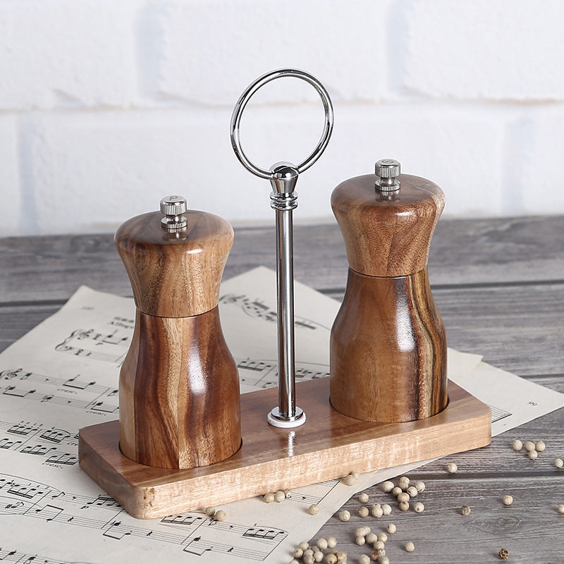 Manual pepper grinder by WoodyKitchenware, made of solid timber with a sleek design for fresh-flavor seasoning.
