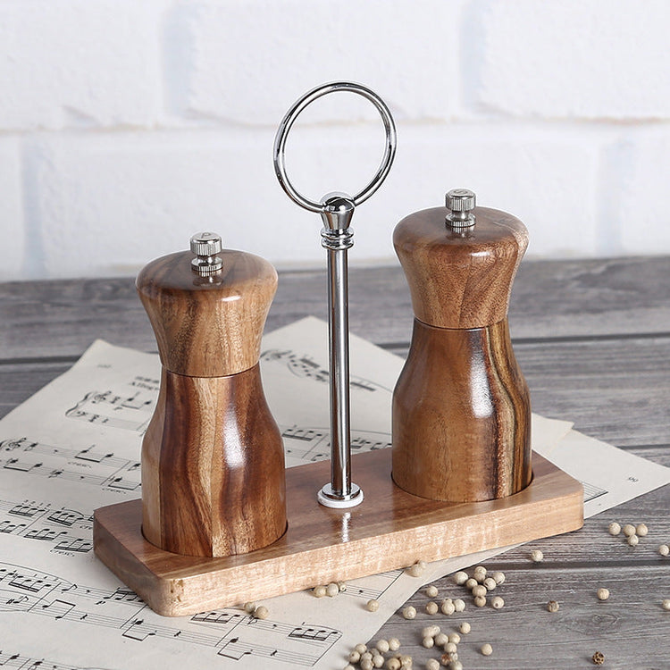 Manual pepper grinder by WoodyKitchenware, made of solid timber with a sleek design for fresh-flavor seasoning.