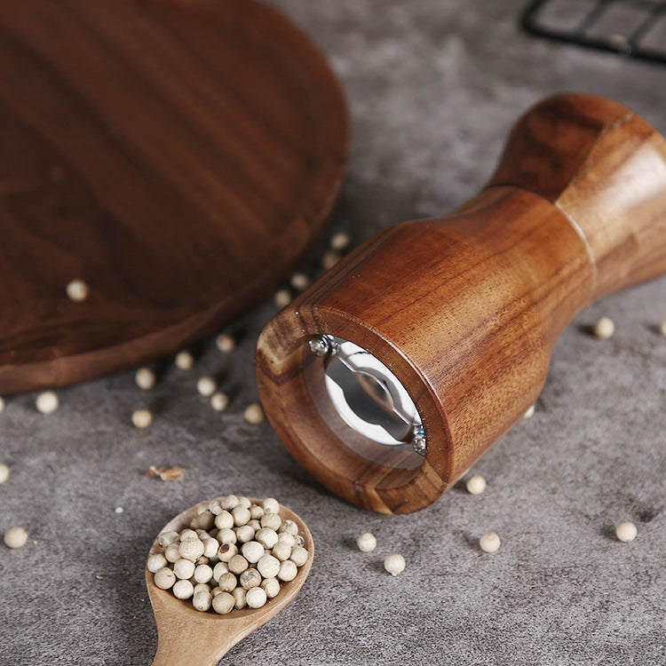 Wooden manual pepper grinder from WoodyKitchenware with a solid timber body, designed for fresh-flavor pepper grinding.