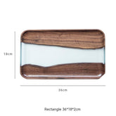 Black walnut tea tray by WoodyKitchenware, featuring a river-inspired solid timber design for elegant tea serving.