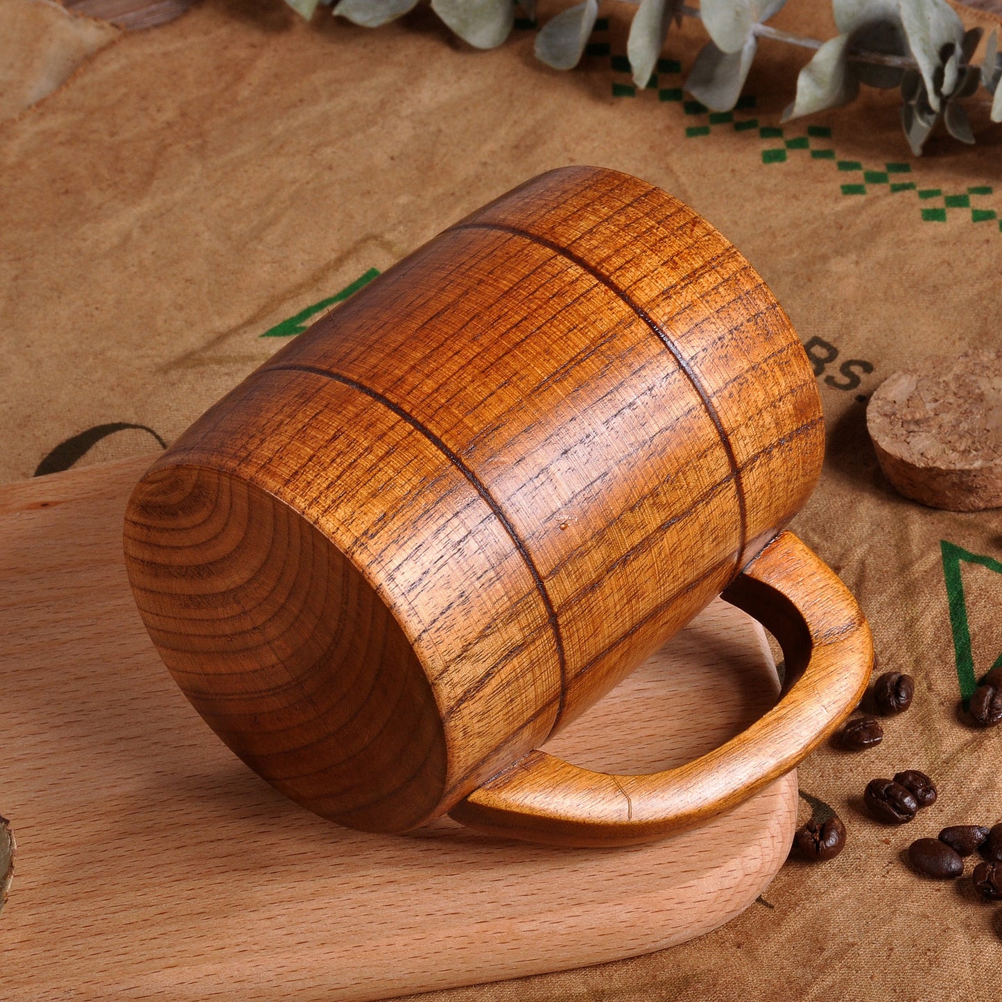 Hand-carved traditional wooden tankard from WoodyKitchenware, showcasing detailed craftsmanship and rustic design.