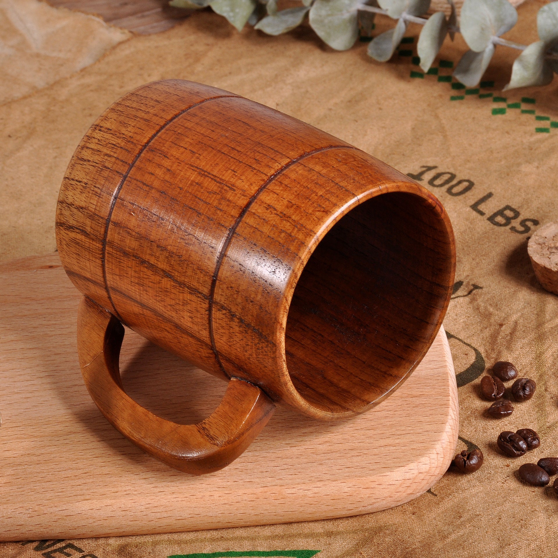 Hand-carved traditional wooden tankard from WoodyKitchenware, showcasing intricate craftsmanship and rustic design.
