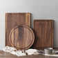 Round black walnut wood cutting board from WoodyKitchenware, perfect as a creative kitchen tray or serving platter.