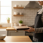 Round black walnut wood cutting board by WoodyKitchenware, perfect as a creative kitchen tray for food prep or serving.