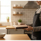Round black walnut wood cutting board by WoodyKitchenware, perfect as a creative kitchen tray for food prep or serving.