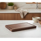 Round black walnut wood cutting board by WoodyKitchenware, designed as a creative whole tray for kitchen use.