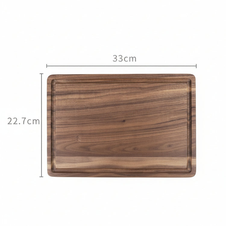 Round black walnut wood cutting board by WoodyKitchenware, showcasing a smooth, natural finish ideal for kitchen prep and serving.