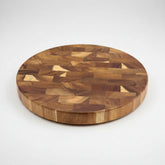Round solid wood splicing cutting board by WoodyKitchenware, showcasing natural wood grain and craftsmanship for kitchen use.