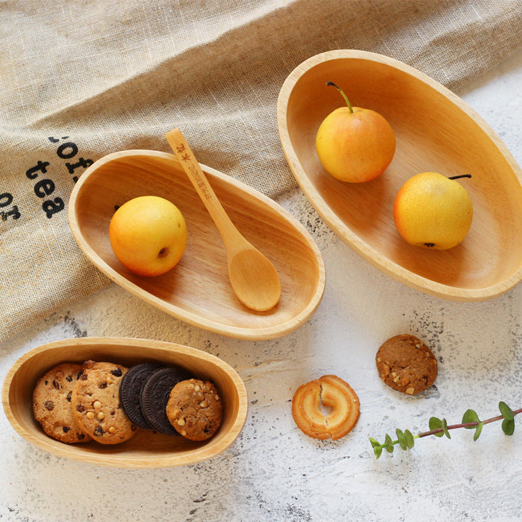 Large oval wooden salad bowl by WoodyKitchenware, minimalist boat curve solid timber design, natural wood grain display.