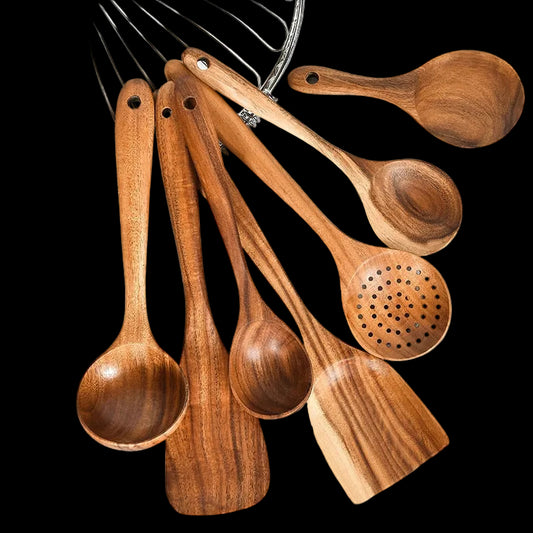 Wooden kitchen utensils set including spoon, ladle, turner, rice colander, and soup skimmer made of natural teak wood by WoodyKitchenware