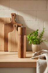 Cylindrical acacia wood pepper grinder with ceramic core from Woody&