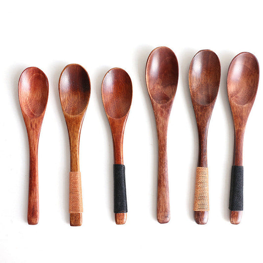 Set of six eco-friendly wooden baby spoons from WoodyKitchenware, gentle and safe for feeding infants.