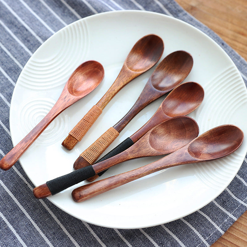 Set of six eco-friendly wooden baby spoons from WoodyKitchenware, gentle and ideal for feeding infants.