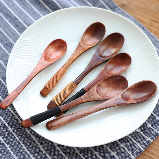 Set of six eco-friendly wooden baby spoons from WoodyKitchenware, gentle and ideal for feeding infants.