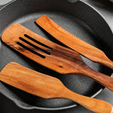 Set of acacia wood long-handled spatulas for mixing and cooking by WoodyKitchenware, featuring premium wooden kitchen utensils.