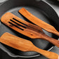 Set of acacia wood long-handled spatulas for mixing and cooking by WoodyKitchenware, featuring premium wooden kitchen utensils.
