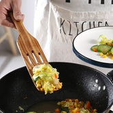 Set of woody acacia long-handled spatulas from WoodyKitchenware, ideal for mixing and cooking with durable wooden utensils.
