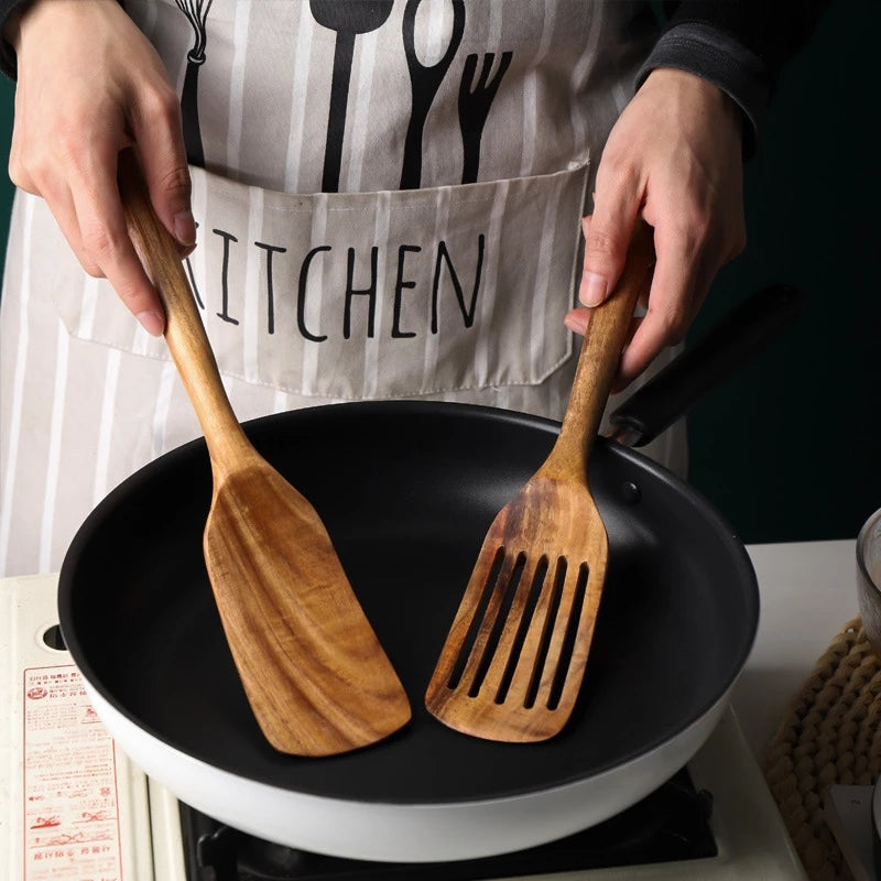 Set of WoodyKitchenware Acacia long-handled spatulas with polished wooden handles and heads, ideal for mixing and cooking.
