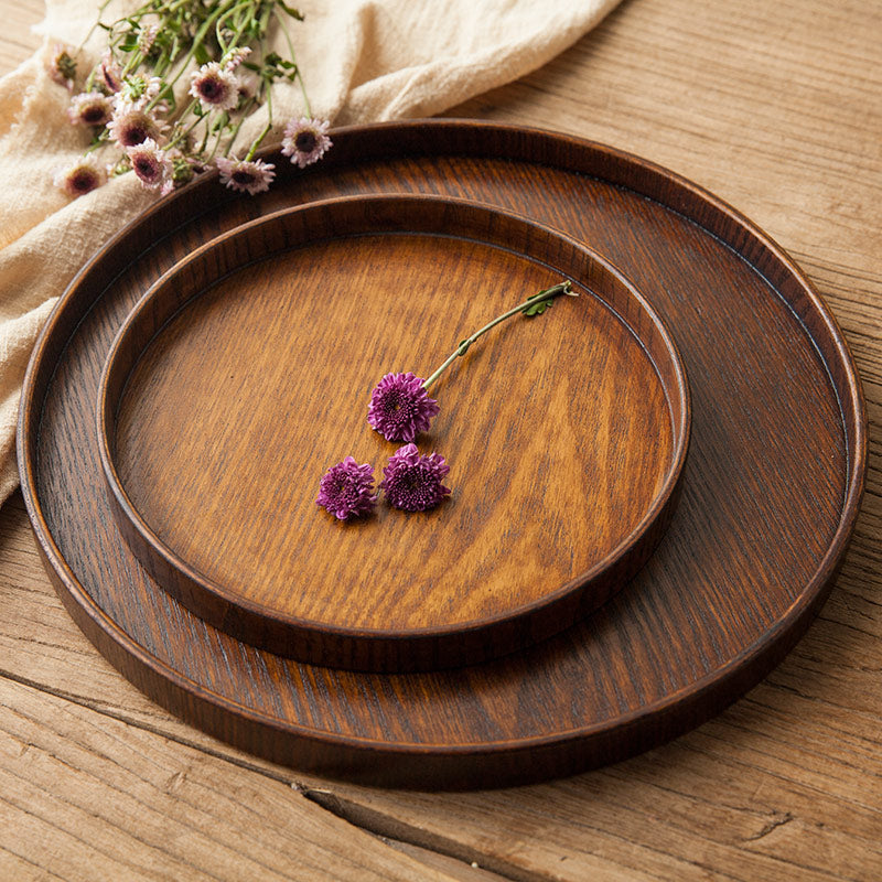 Round wooden tray by WoodyKitchenware made of solid timber, 24cm diameter, ideal as a centerpiece or serving tray.
