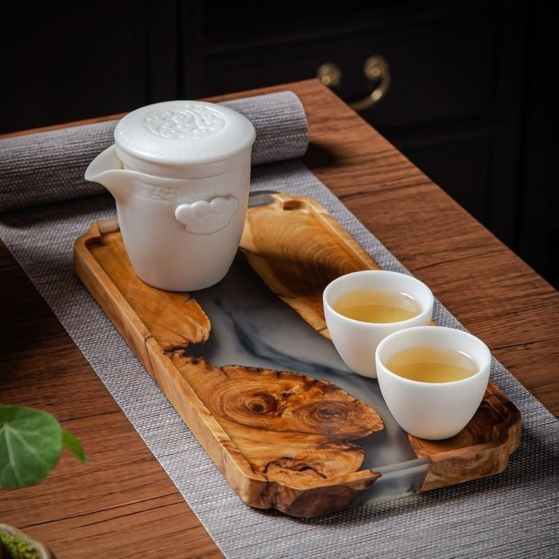 Rectangular wooden tea tray with epoxy-enhanced bamboo and resin, featuring an elegant, dry surface for serving tea in a modern style.