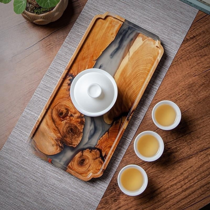 Elegant rectangular bamboo and resin tea tray by WoodyKitchenware, featuring epoxy-enhanced dry wooden surface for serving tea.