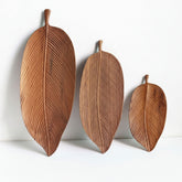 Wooden saucer fruit tray by WoodyKitchenware with natural wood grain, perfect for elegant dining and serving fresh fruit.