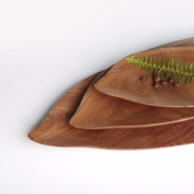 Wooden saucer fruit tray by WoodyKitchenware featuring natural wood grain and elegant design for stylish dining presentation.